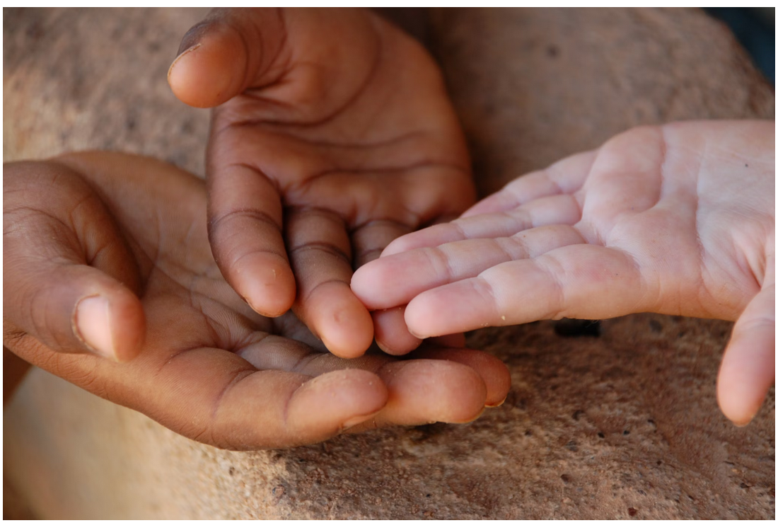 Hands of children together in unity
